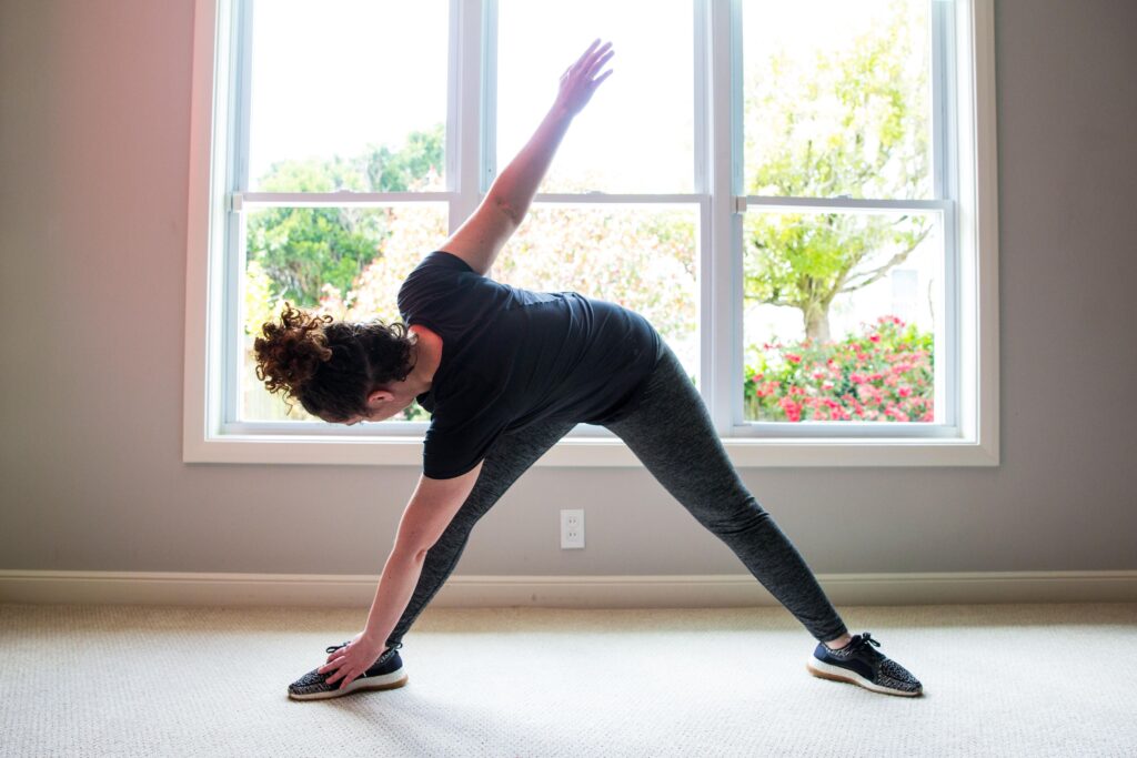 woman touching toes stretching. 